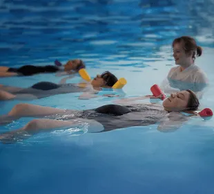 A fitness class in the water for pregnancy taking place at Swim Works Leamington Spa