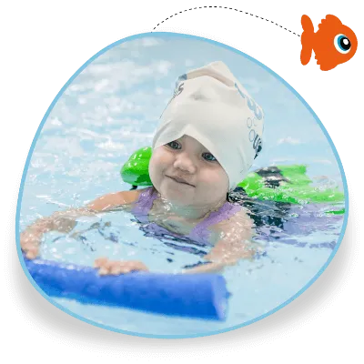 A young swimmer holds a woggle in her swimming lesson and she wears a Swim Works swimming cap
