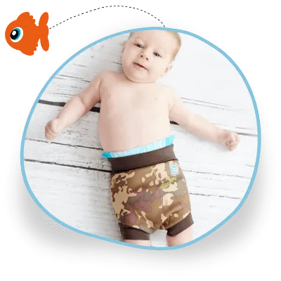 A baby lies ready for their first swim, wearing a swim nappy and outer Happy Nappy