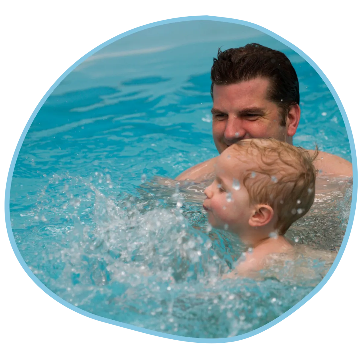 A dad and a toddler in a swimming lesson at Swim Works