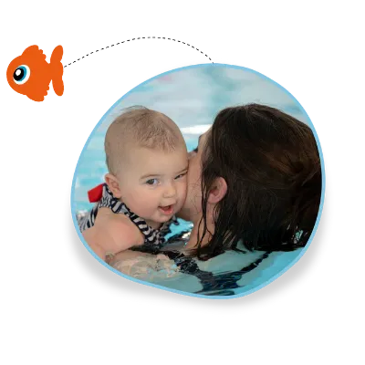 A parent and baby swim together in their swimming lesson