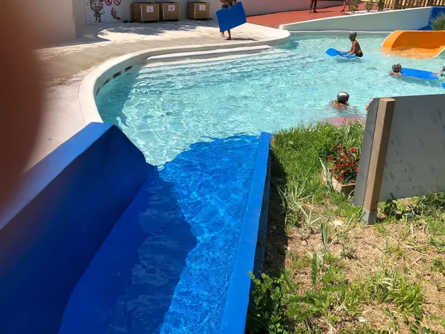 Pacific Blue Slide Concrete Pool