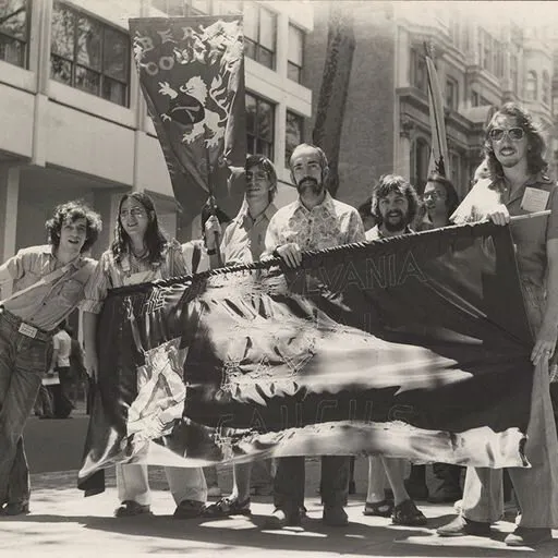Pennsylvania Rural Gay Caucus contingent poses with their banner at the Philadelphia Gay Pride Parade, 1976, photo by Bari Lee Weaver.