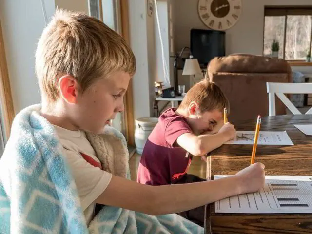 kids doing homework in a comfortable home