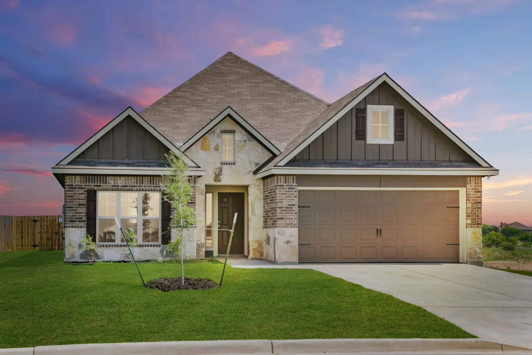 This is a Stylecraft Builders model home exterior image for their new homes in Southern Pointe near College Station, TX.