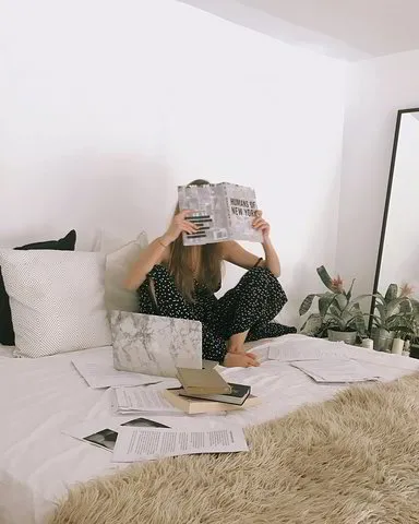 FAQ - Lady with book covering her face