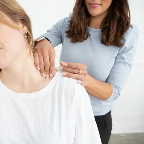 physiotherapist treating toddler