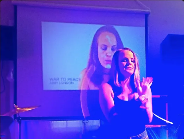 Image from the 'Unmasked' event featuring Abby London, a dedicated release show for her powerful song 'Anxiety', signifying the unveiling of her thought-provoking anti-pop musical narrative.