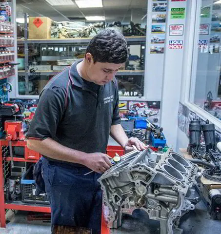 American SUV Mechanic Overhauling a Jeep Engine
