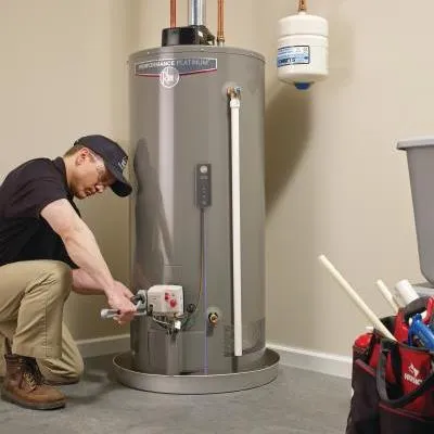 HVAC Tech performing a service on a water heater